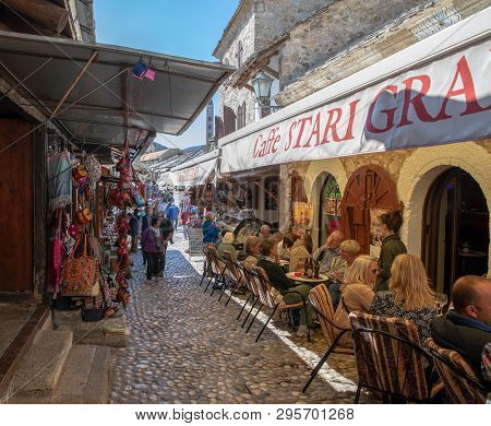 Mostar, Bosnia And Herzegovina - April, 2019: Mostar Old Town, Tourists In The Market With Restauran