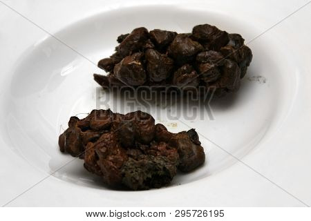 Human Poop Excrements In White Plate Brown Black