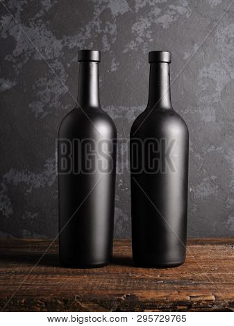 Red Wine Bottle On A Wooden Background