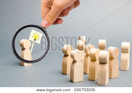 Magnifying Glass Is Looking At A Man With A Poster With A Picture Of The Bulb 