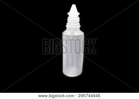 Plastic Bottle Of Normal Saline Isolated On Black Background. High Resolution Image Gallery.