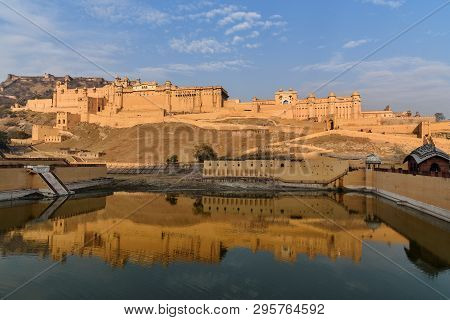 Amber Fort And Palace In Maotha Lake At Morning. Jaipur. Rajasthan. India
