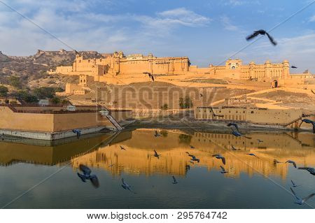 Amber Fort And Palace In Maotha Lake At Morning. Jaipur. Rajasthan. India