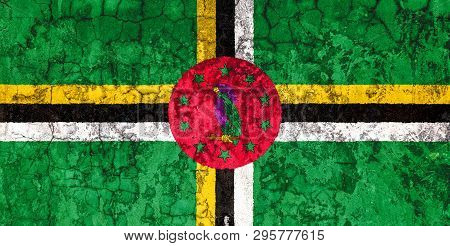National Flag Of Dominica On The Background Of The Old Wall Covered With Peeling Paint. Concept Of C