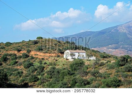View Across Countryside Towards The Sierra De Mijas Mountains With A Traditional Spanish Finca In Th