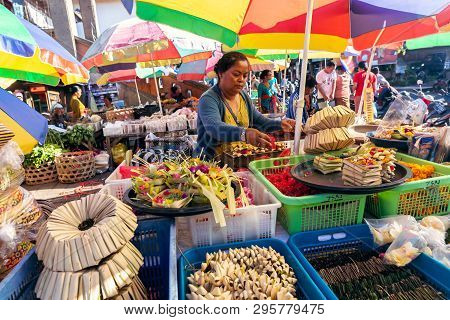 Bali, Indonesia - February 21, 2019: Traditional Balinese Handmade Offering To Gods On A Morning Mar