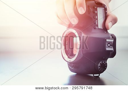 Photographer Is Using A Professional Camera, Open Sensor And Sunlight