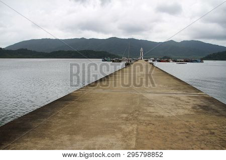 Cement Jetty Bridge Stretches To The Sea. Used For The Docking Of Ships, After Finding Out The Fish.