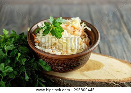 Salad Homemade Sauerkraut In A Glass Jar On A Table