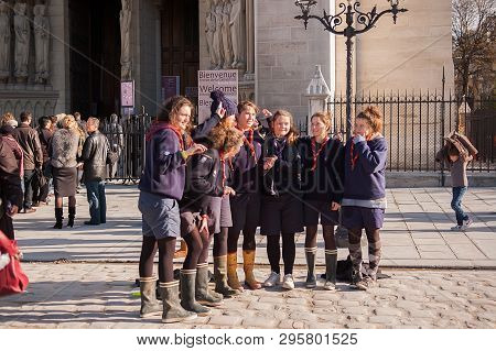 Paris, France - November 4, 2012: Beautiful Young Tourists In Paris, Making Funny Picture Near Notre