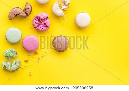 Brignt Macarons For Sweet Break On Yellow Background Top View Mock Up