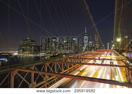 New York City, Usa - 04.13.2014: Cars Leaving Manhattan Over The Brooklyn Bridge At Night.