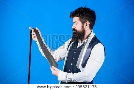 The Tie Is Just The Ticket For Any Menswear Outfits. Bearded Man Choosing Neck Tie. Brutal Hipster H