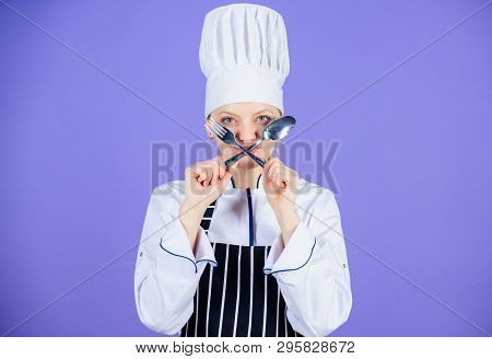 Lets Spoon It Out. Cook Forming The Sign Of Cross With Spoon And Fork. Pretty Woman Holding Dinner F