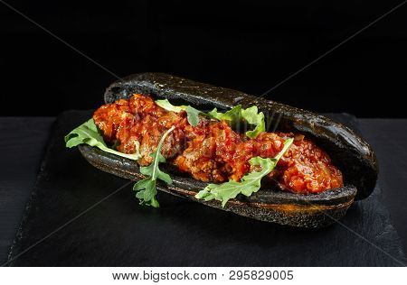 Black Hot Dog Bun With Minced Meat.