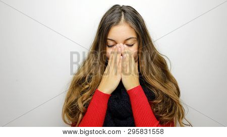 Sneezing Young Woman Sick. Young Woman Being Cold Wearing Scraf And Sweater. Copy Space.