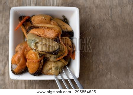 Pickled Mussels With Carrot, Lemon Juice And Oil.