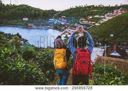 Couple Asian Traveling Together On Mountain In Ban Rak Thai Village Countryside. Travel, Camping In 