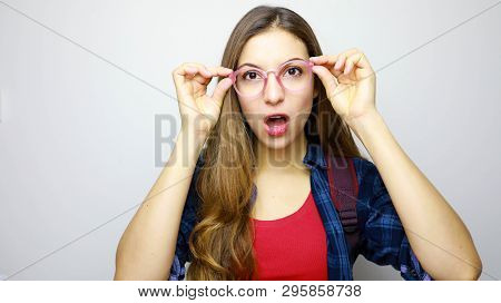 Close Up Of Emotional Incredulous Open Mouth Girl With Glasses. Disbelieve Concept.