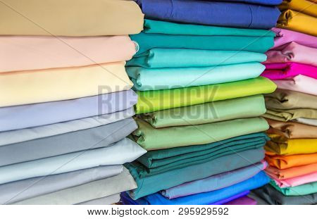 Rolls Of Fabric And Textiles In A Factory Shop Or Store Or Bazar. Multi Different Colors And Pattern