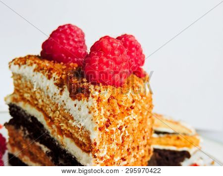 A Small Piece Of Fresh Cake With Red Raspberries. Dessert For Tea. Raspberry Cake And Many Fresh Ras