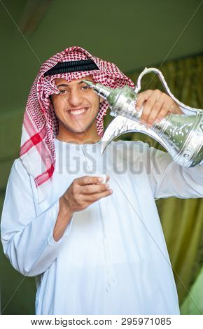 Arbic boy pouring coffee