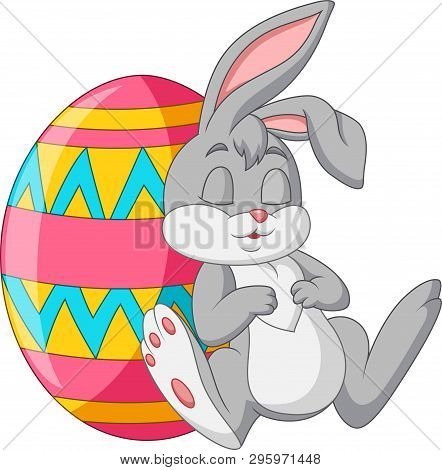Cute Rabbit Sleeping Beside An Easter Egg