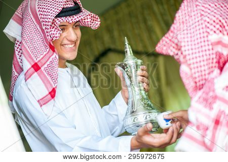 Arbic boy pouring coffee