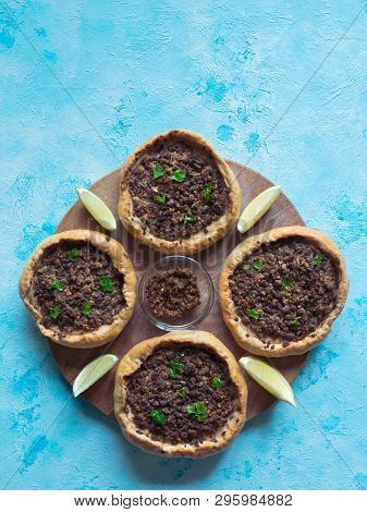 Traditional Lebanese Meat Pies On A Blue Table. Top View.