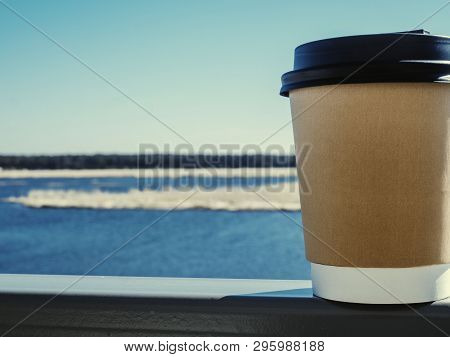 Paper Cup Of Coffee On Natural Morning Background. Film Effect.