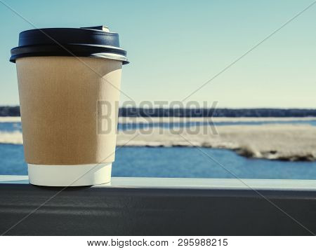 Paper Cup Of Coffee On Natural Morning Background. Film Effect.