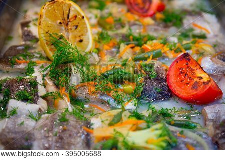 Served Tasty Fish With Lemon And Vegetadles