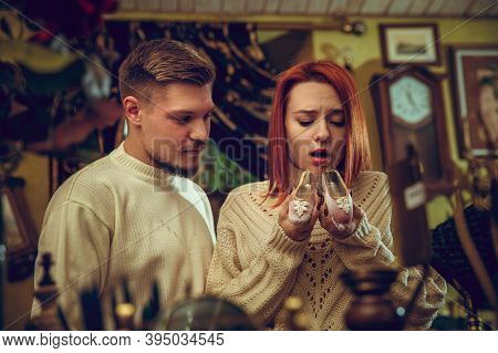 Shoe. Smiling Family, Caucasian Couple Looking For Home Decoration And Holidays Gifts In Household S