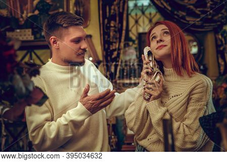 Shoe. Smiling Family, Caucasian Couple Looking For Home Decoration And Holidays Gifts In Household S