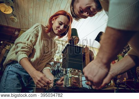Game. Smiling Family, Caucasian Couple Looking For Home Decoration And Holidays Gifts In Household S