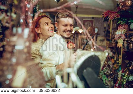 Lovely. Smiling Family, Caucasian Couple Looking For Home Decoration And Holidays Gifts In Household