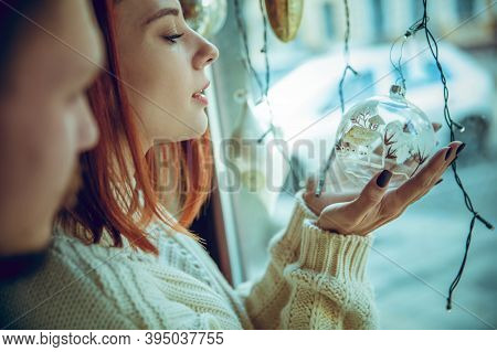 Snowly. Smiling Family, Caucasian Couple Looking For Home Decoration And Holidays Gifts In Household