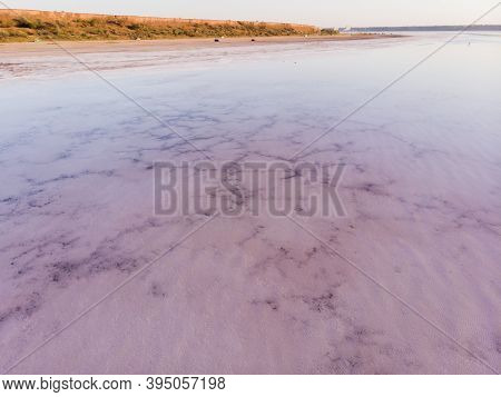 Amazing Forms Of Land Surface Made Of Water And Salt, Nature Abstract Background, Aerial View. Pink 