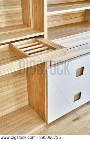 Modern Wardrobe With Slide Out Rack For Coathangers. Detail Of Modern Furniture