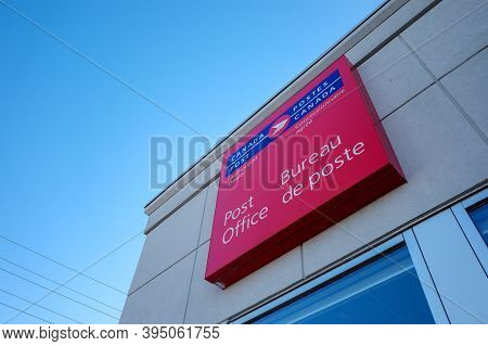 Ottawa, Ontario, Canada - November 5, 2020: A Canada Post Authorized Dealer Sign At A Post Office Lo