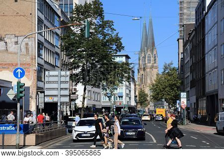 Dusseldorf, Germany - September 19, 2020: People Cross The Street In Downtown Dusseldorf, Germany. D
