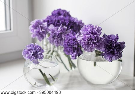 Bridal Bouquets Of Lilac Carnations In A Four Round Glass Vases Different Sizes As Table Decoration