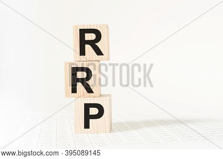 Word Rrp On Wooden Blocks, White Background, Business Concept. Business And Finance