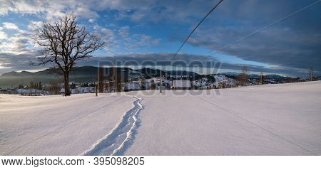 Small Alpine Village And Winter Snowy Mountains In First Sunrise Sunlight Around, Voronenko, Carpath