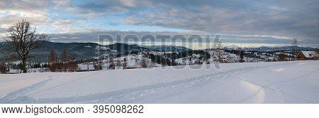 Small Alpine Village And Winter Snowy Mountains In First Sunrise Sunlight Around, Voronenko, Carpath