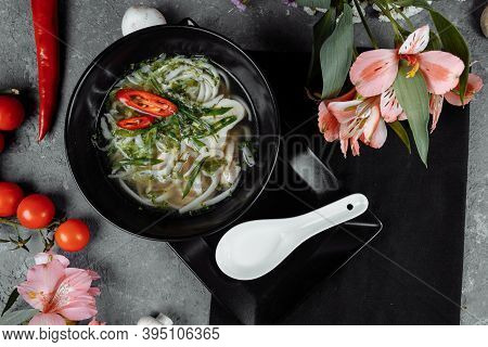 Bowl Of Chicken Noodle On Gray Concrete Background