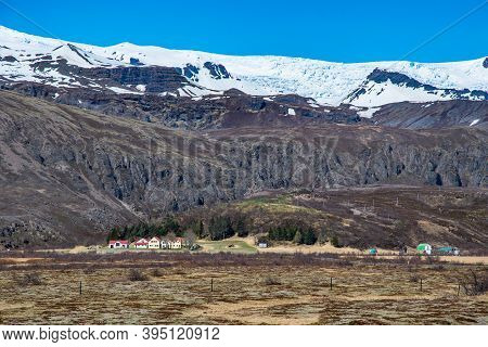 Farm Kvisker With Oraefajokull Glacier In The Background