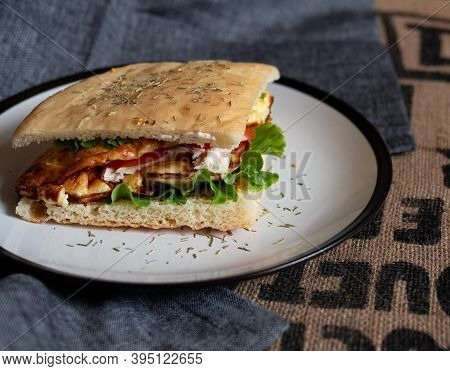 Craft Food. Delicious Juicy Sandwich With Chicken, Fried Egg, Tomato And Fresh Salad.