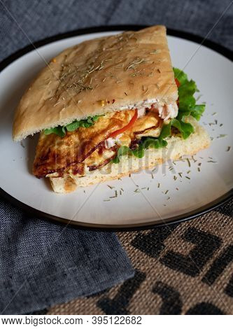 Craft Food. Delicious Juicy Sandwich With Chicken, Fried Egg, Tomato And Fresh Salad.