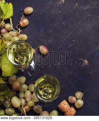 Champagne In Glasses, Grapes With Vine, Black Background, Top View